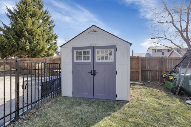 view of shed featuring a fenced backyard