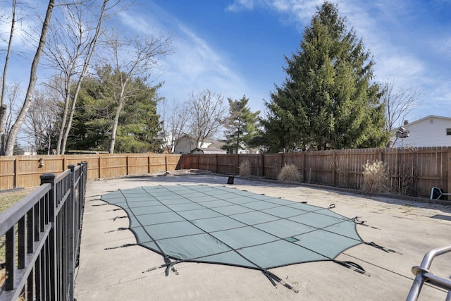 view of pool featuring a patio area, a fenced in pool, and a fenced backyard