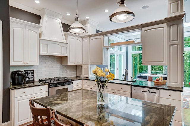 kitchen with dishwashing machine, white cabinets, gas stove, and a sink