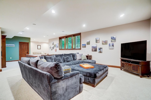 living room with recessed lighting, baseboards, and light carpet