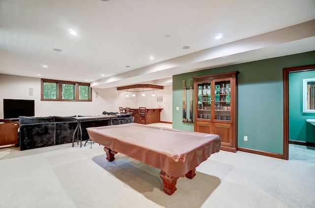 rec room featuring recessed lighting, baseboards, light carpet, and wet bar