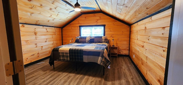 bedroom with lofted ceiling, wood ceiling, wood finished floors, and wood walls