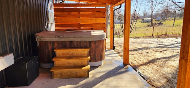 view of patio / terrace with a hot tub