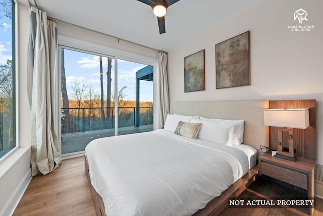 bedroom with a ceiling fan, access to exterior, wood finished floors, and baseboards