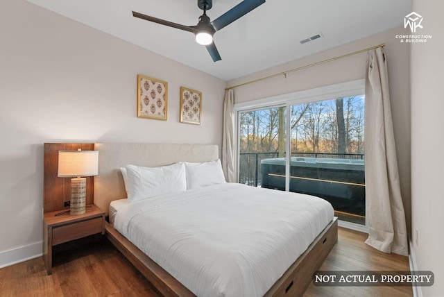 bedroom featuring ceiling fan, wood finished floors, visible vents, and baseboards