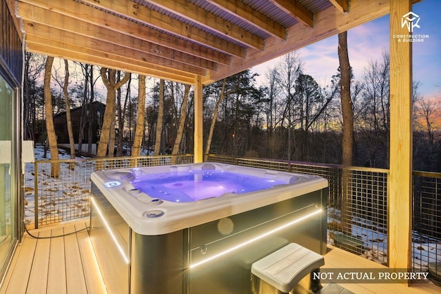 wooden terrace featuring a hot tub