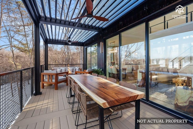 deck with an outdoor living space, outdoor dining space, and a ceiling fan