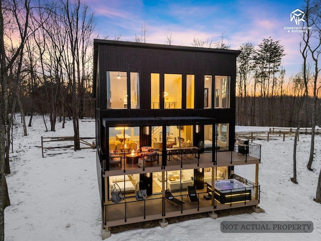 snow covered house with a balcony