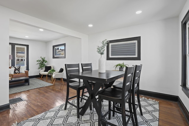 dining room with visible vents, recessed lighting, baseboards, and dark wood-style flooring