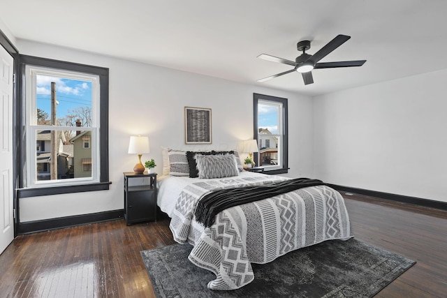 bedroom with baseboards, ceiling fan, and hardwood / wood-style flooring