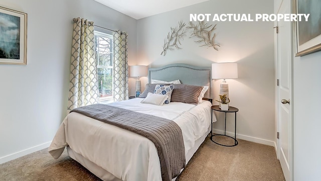 bedroom with baseboards and carpet floors