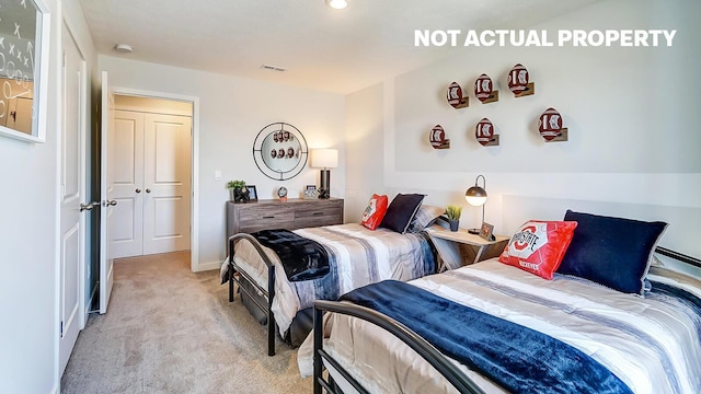 bedroom featuring visible vents and light colored carpet