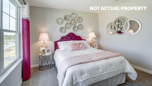 bedroom featuring baseboards, multiple windows, and carpet flooring