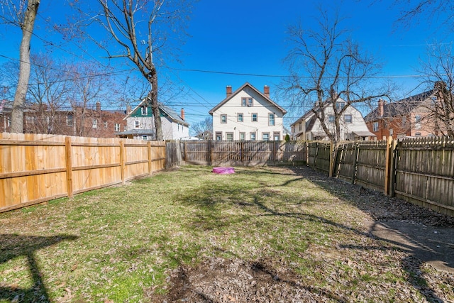 view of yard with a fenced backyard