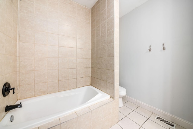 bathroom featuring tile patterned flooring, visible vents, toilet, and baseboards