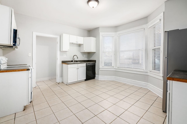 kitchen with white range with electric cooktop, freestanding refrigerator, white cabinets, black dishwasher, and dark countertops