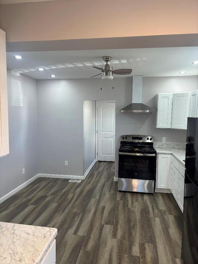 kitchen featuring dark wood-style floors, stainless steel range with electric cooktop, fridge, wall chimney range hood, and baseboards