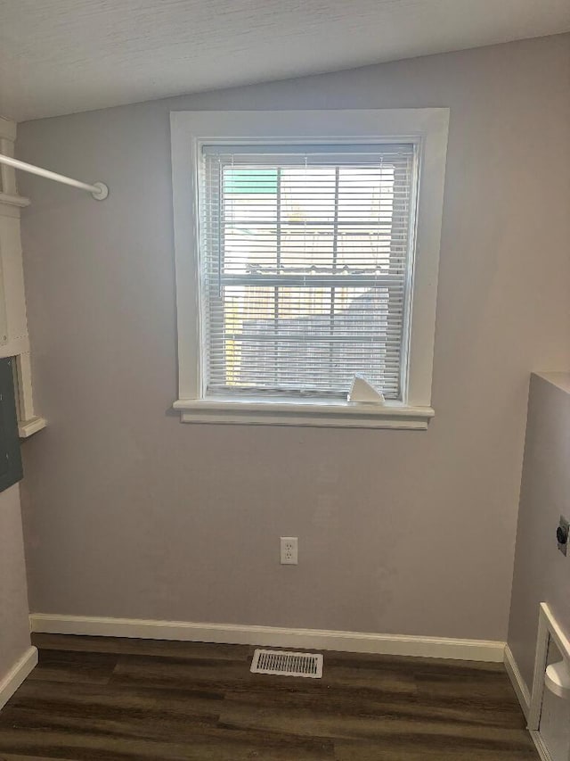 laundry room with visible vents, laundry area, baseboards, hookup for an electric dryer, and dark wood-style flooring