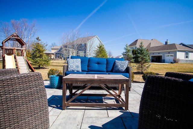 view of patio with outdoor lounge area and a playground