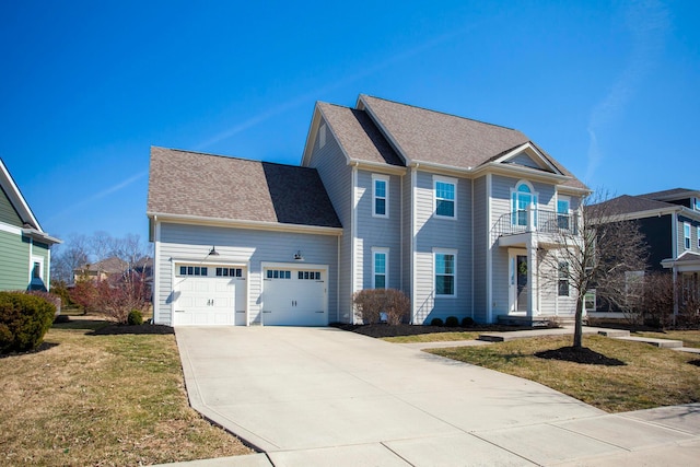 view of front of property with a front lawn, driveway, roof with shingles, a garage, and a balcony