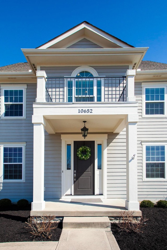 entrance to property with a balcony