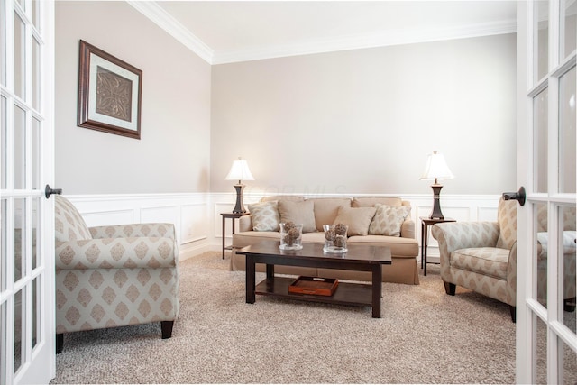 living area with french doors, wainscoting, carpet floors, and ornamental molding