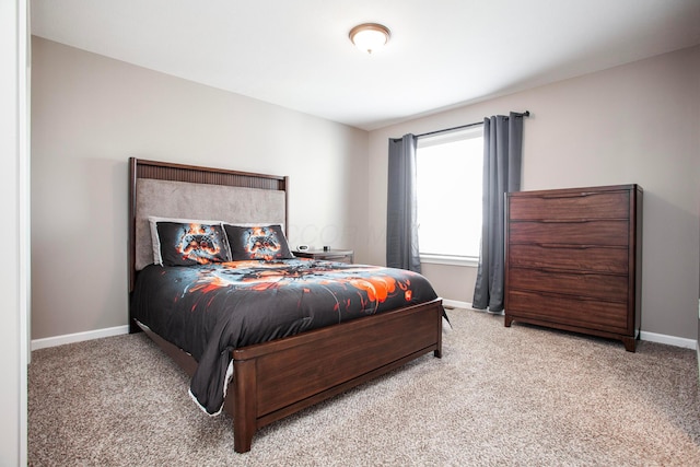 carpeted bedroom with baseboards