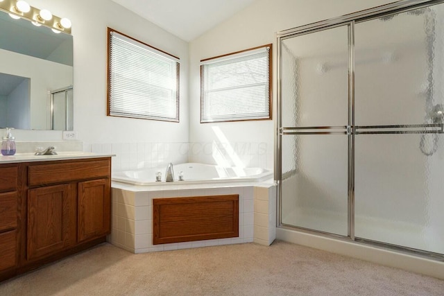 bathroom with a garden tub, lofted ceiling, carpet flooring, an enclosed shower, and vanity