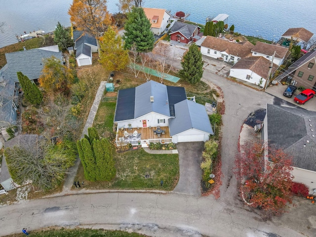 birds eye view of property featuring a residential view and a water view