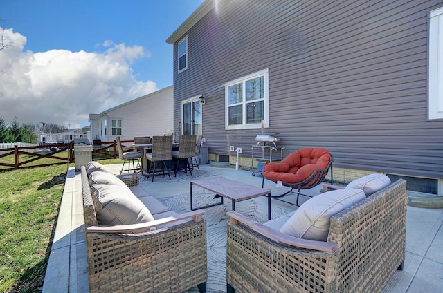 view of patio with outdoor dining space, an outdoor living space, and fence