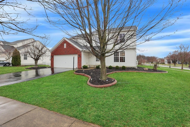 view of front of property featuring brick siding, a garage, a front yard, and driveway