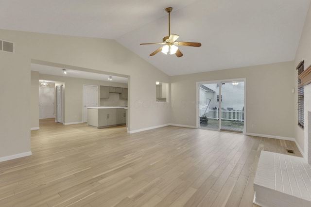 unfurnished living room featuring a ceiling fan, visible vents, light wood finished floors, and baseboards