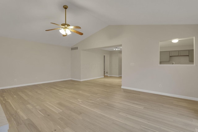 unfurnished living room with visible vents, light wood-style floors, baseboards, ceiling fan, and vaulted ceiling