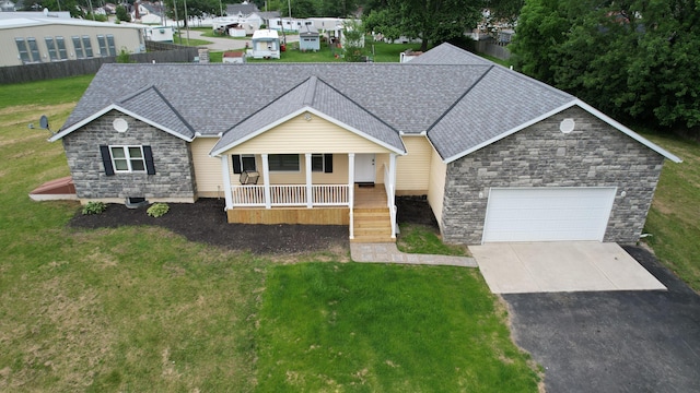 1025 Edison Ave, Marion, OH 43302 - single story home with stone siding, a shingled roof, driveway, covered porch, and a garage