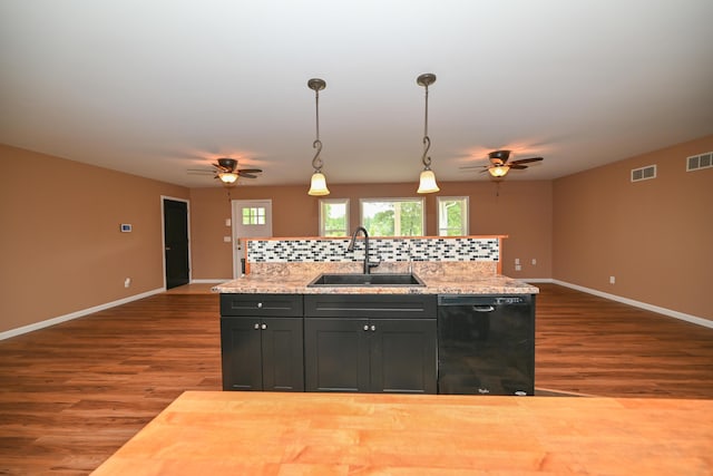 1025 Edison Ave, Marion, OH 43302 - kitchen with black dishwasher, a ceiling fan, backsplash, dark wood-type flooring, and healthy amount of natural light