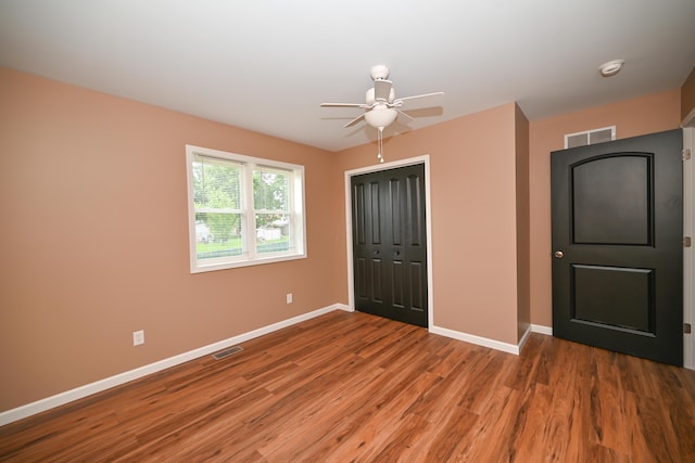 1025 Edison Ave, Marion, OH 43302 - unfurnished bedroom with wood finished floors, a closet, and a ceiling fan