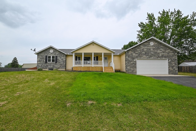 1025 Edison Ave, Marion, OH 43302 - ranch-style home with a porch, asphalt driveway, stone siding, and a garage