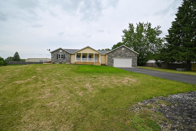 1025 Edison Ave, Marion, OH 43302 - ranch-style house with driveway, a porch, an attached garage, and stone siding