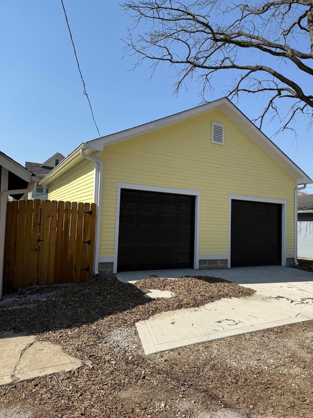 garage with fence