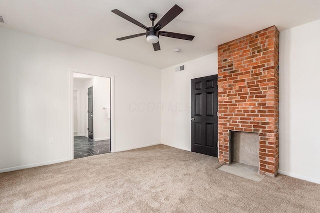 unfurnished living room featuring visible vents, baseboards, carpet flooring, a fireplace, and a ceiling fan