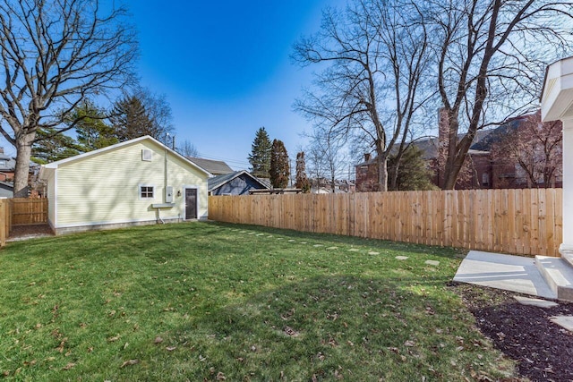 view of yard with a fenced backyard