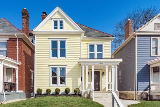 view of front of home featuring a shingled roof