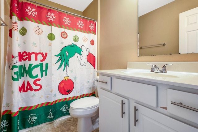 full bath with a shower with shower curtain, toilet, and vanity