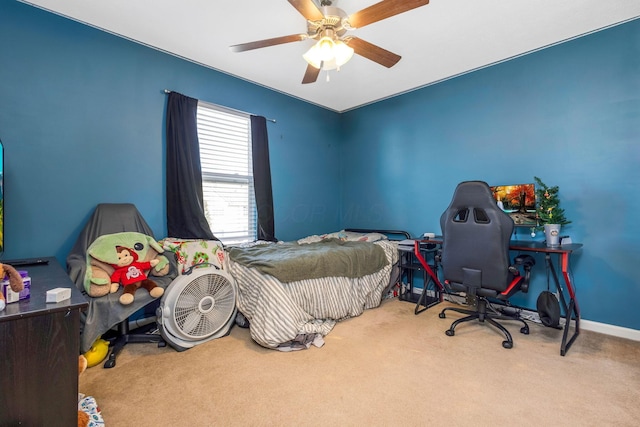 carpeted bedroom with baseboards and ceiling fan