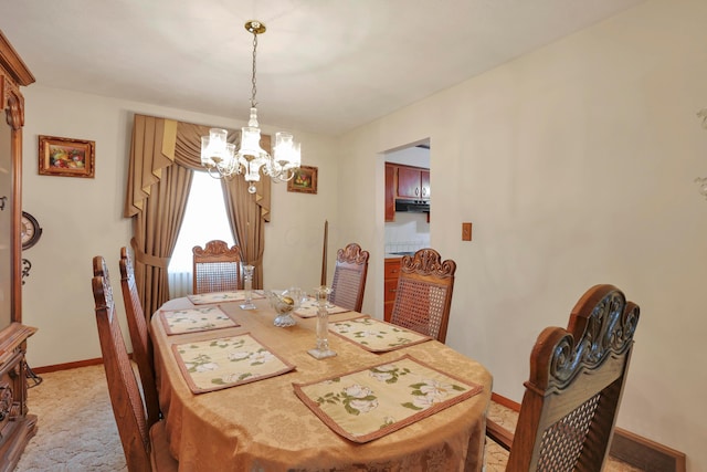 2639 Halleck Dr, Columbus, OH 43209 - dining area featuring a chandelier and baseboards