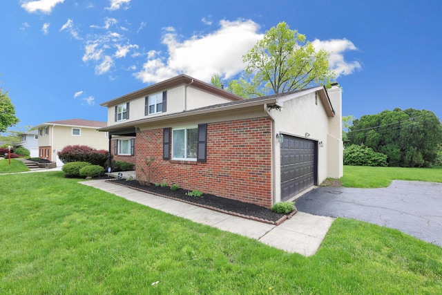 2639 Halleck Dr, Columbus, OH 43209 - view of property exterior featuring driveway, a chimney, an attached garage, brick siding, and a lawn
