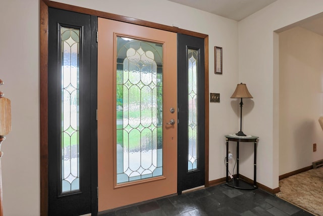 2639 Halleck Dr, Columbus, OH 43209 - foyer with healthy amount of natural light, baseboards, and dark stone finish floors
