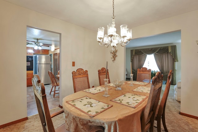 2639 Halleck Dr, Columbus, OH 43209 - dining space with a chandelier, a ceiling fan, and baseboards