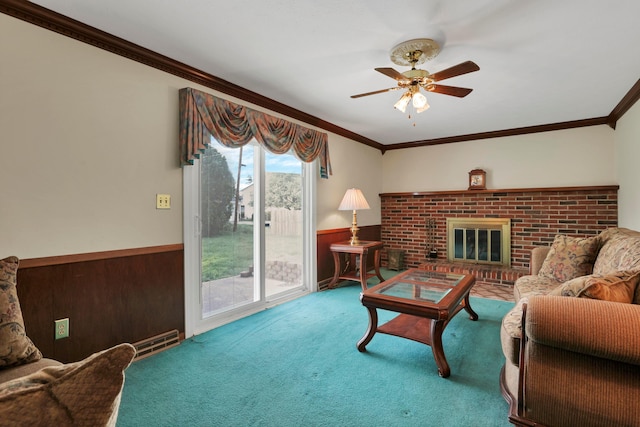2639 Halleck Dr, Columbus, OH 43209 - living area featuring a ceiling fan, carpet, crown molding, a wainscoted wall, and a brick fireplace