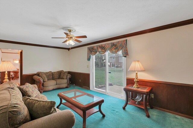 2639 Halleck Dr, Columbus, OH 43209 - living area featuring wainscoting, carpet flooring, wood walls, ceiling fan, and ornamental molding